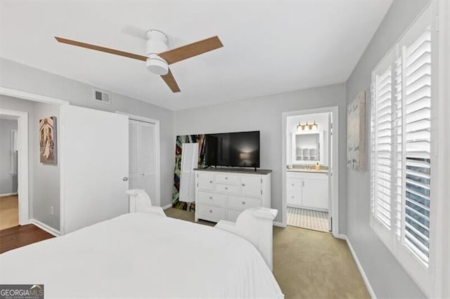 2 Arpege Way NW, Atlanta, GA 30327 - bedroom featuring a closet, ceiling fan, ensuite bathroom, and baseboards