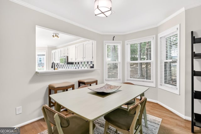 5037 Laurel Springs Way SE, Smyrna, GA 30082 - dining area featuring light wood finished floors and ornamental molding