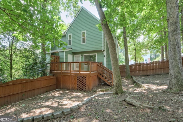 5037 Laurel Springs Way SE, Smyrna, GA 30082 - rear view of house featuring a wooden deck and stairway