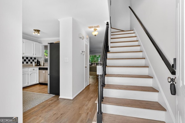 5037 Laurel Springs Way SE, Smyrna, GA 30082 - stairway with wood finished floors and baseboards