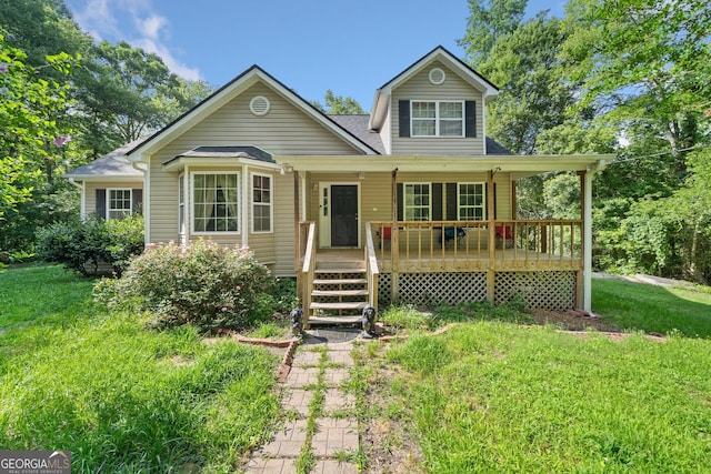 2958 Paul Harris Rd, Dallas, GA 30157 - view of front of property with a porch, a front yard, and a shingled roof