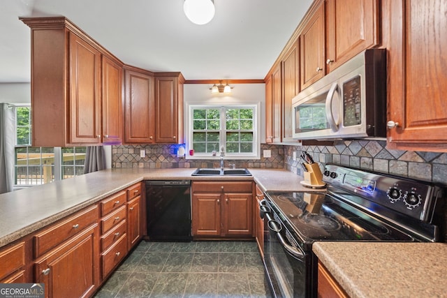 2958 Paul Harris Rd, Dallas, GA 30157 - kitchen featuring black appliances, brown cabinets, tasteful backsplash, light countertops, and crown molding
