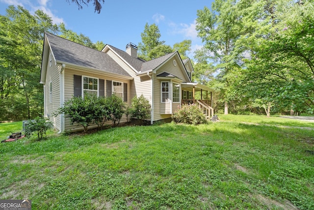 2958 Paul Harris Rd, Dallas, GA 30157 - view of front of home featuring a chimney, a front yard, and a shingled roof