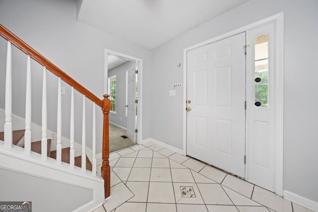 2958 Paul Harris Rd, Dallas, GA 30157 - foyer entrance featuring stairs and light tile patterned floors