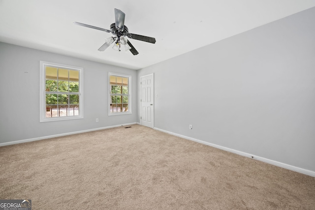2958 Paul Harris Rd, Dallas, GA 30157 - carpeted spare room with baseboards and ceiling fan