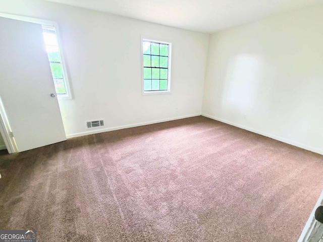 1225 Creek Forest Ct NW, Conyers, GA 30012 - carpeted spare room featuring baseboards