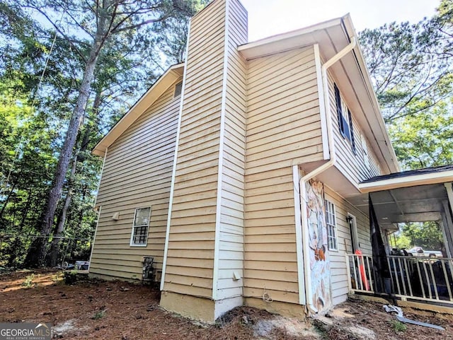 1225 Creek Forest Ct NW, Conyers, GA 30012 - view of side of home with a chimney