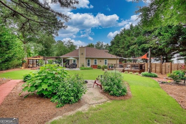 55 Ashton Pl, Covington, GA 30016 - rear view of property featuring a chimney, a deck, and a patio