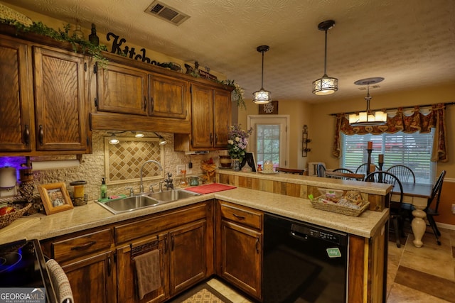 55 Ashton Pl, Covington, GA 30016 - kitchen with dishwasher, a sink, a peninsula, backsplash, and light countertops