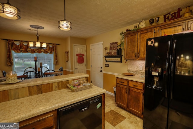 55 Ashton Pl, Covington, GA 30016 - kitchen with black appliances, light countertops, decorative light fixtures, a chandelier, and decorative backsplash