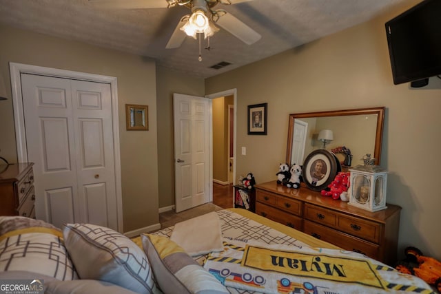 55 Ashton Pl, Covington, GA 30016 - bedroom with baseboards, ceiling fan, a closet, and carpet