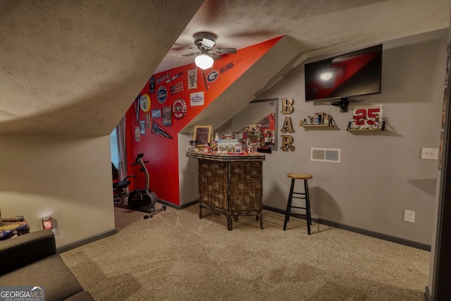 55 Ashton Pl, Covington, GA 30016 - indoor dry bar featuring carpet floors, a textured ceiling, lofted ceiling, baseboards, and ceiling fan
