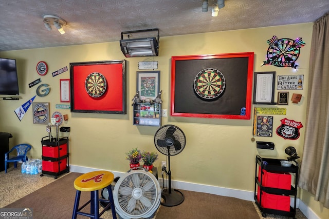 55 Ashton Pl, Covington, GA 30016 - miscellaneous room with baseboards, carpet, and a textured ceiling