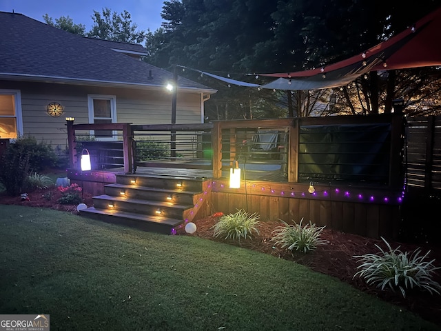 55 Ashton Pl, Covington, GA 30016 - entrance to property with roof with shingles, a deck, and a lawn