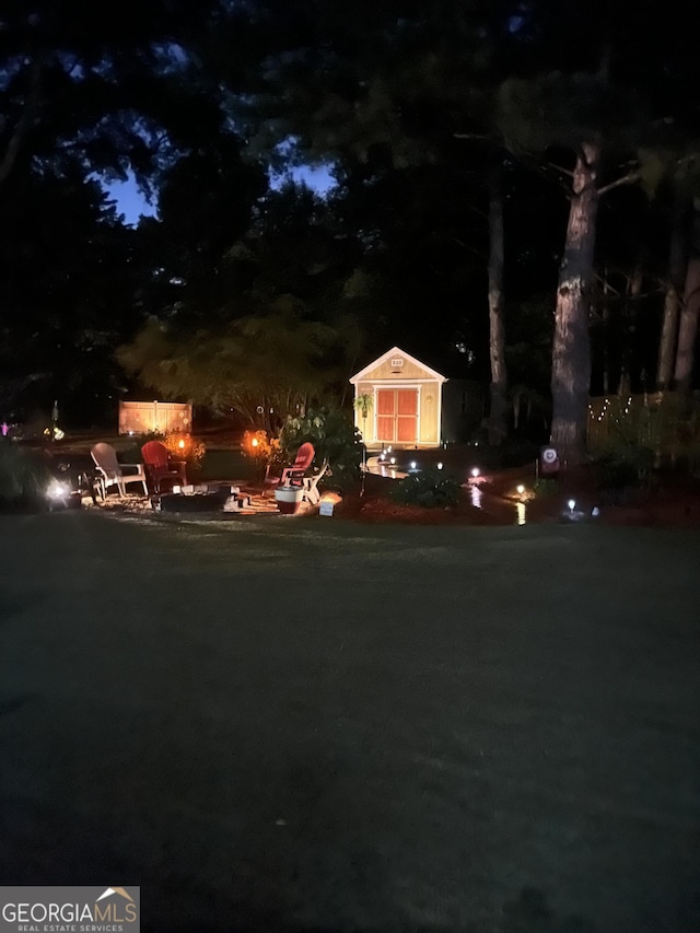 55 Ashton Pl, Covington, GA 30016 - yard at night featuring an outdoor fire pit