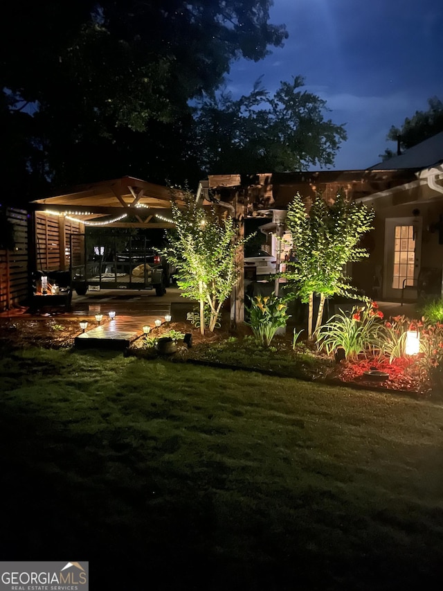 55 Ashton Pl, Covington, GA 30016 - yard at twilight featuring a wooden deck and a yard