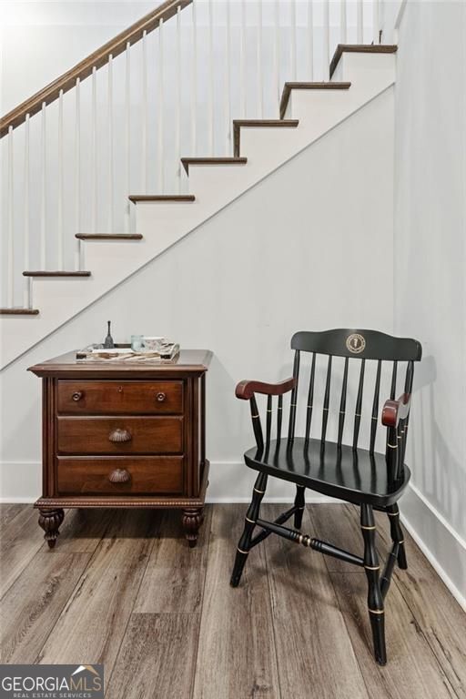 5971 Brundage Ln, Norcross, GA 30071 - sitting room with stairs and wood finished floors