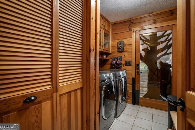 371 Little Rock Creek Ct, Cherry Log, GA 30522 - laundry area featuring independent washer and dryer, wooden walls, light tile patterned floors, and a textured ceiling