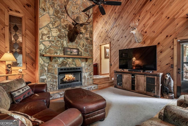 371 Little Rock Creek Ct, Cherry Log, GA 30522 - carpeted living room featuring a fireplace, ceiling fan, and wood walls