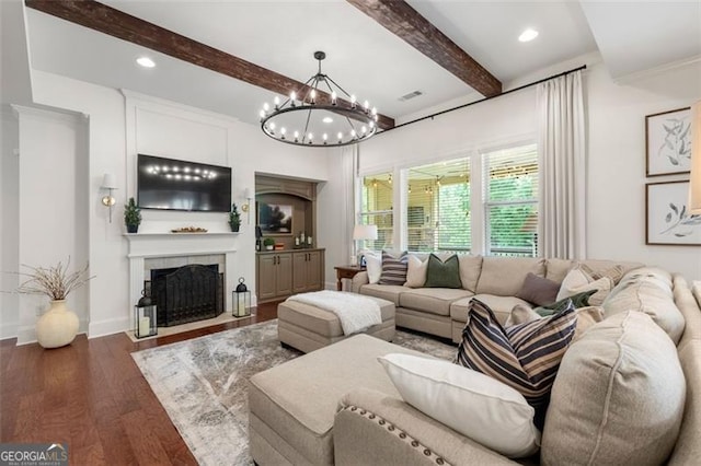 2680 Augeron Ct, Alpharetta, GA 30004 - living room featuring beamed ceiling, wood finished floors, a fireplace, a chandelier, and recessed lighting