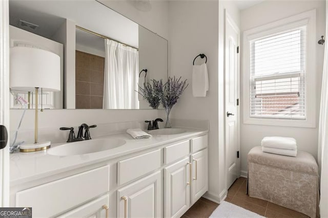 2680 Augeron Ct, Alpharetta, GA 30004 - full bath featuring plenty of natural light, double vanity, and tile patterned floors