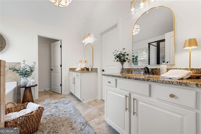 2680 Augeron Ct, Alpharetta, GA 30004 - full bathroom with two vanities, a garden tub, and a shower with door