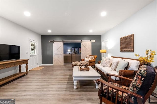 2680 Augeron Ct, Alpharetta, GA 30004 - living room with a barn door, recessed lighting, and wood finished floors
