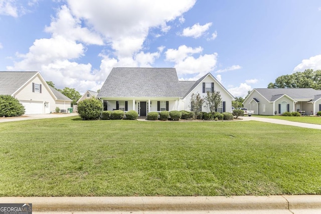 76 Duke Ln, Kathleen, GA 31047 - view of front facade featuring covered porch and a front yard