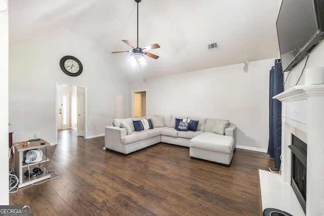 76 Duke Ln, Kathleen, GA 31047 - living area featuring ceiling fan, high vaulted ceiling, a fireplace with raised hearth, and dark wood finished floors