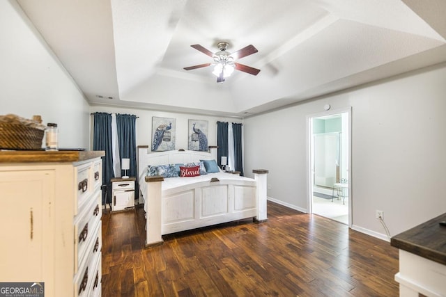 76 Duke Ln, Kathleen, GA 31047 - bedroom featuring a tray ceiling, dark wood finished floors, and a ceiling fan