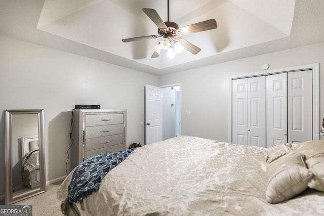 76 Duke Ln, Kathleen, GA 31047 - carpeted bedroom with a closet, a raised ceiling, and ceiling fan