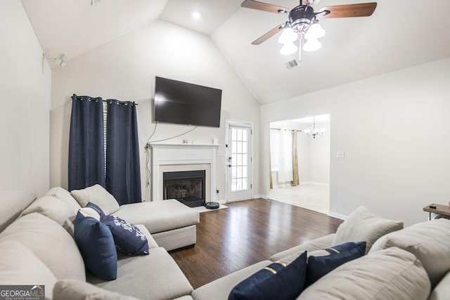 76 Duke Ln, Kathleen, GA 31047 - living area with high vaulted ceiling, wood finished floors, a chandelier, a ceiling fan, and a fireplace with flush hearth