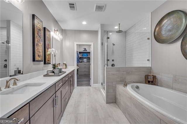 6445 Lucent Ln, Atlanta, GA 30328 - bathroom with a stall shower, double vanity, a bath, and recessed lighting