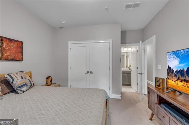 6445 Lucent Ln, Atlanta, GA 30328 - bedroom with light colored carpet, a closet, baseboards, and ensuite bathroom