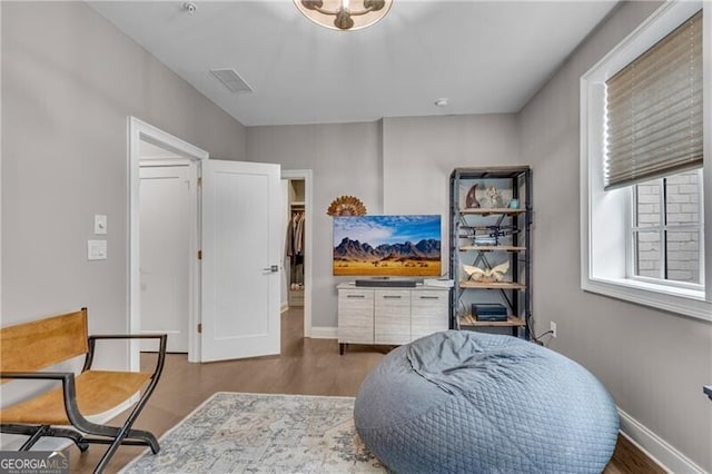 6445 Lucent Ln, Atlanta, GA 30328 - sitting room with wood finished floors and baseboards