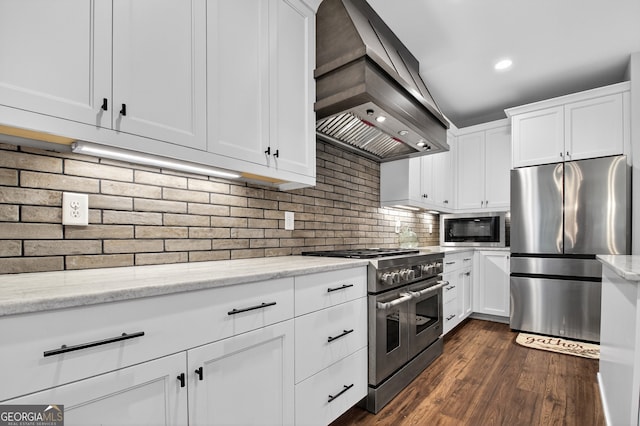 57 Clear Creek Valley Dr Unit 8A, Ellijay, GA 30536 - kitchen featuring appliances with stainless steel finishes, custom range hood, white cabinetry, light stone counters, and recessed lighting