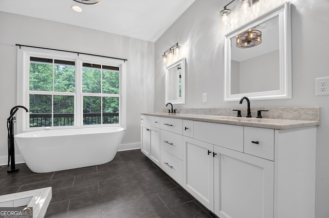 57 Clear Creek Valley Dr Unit 8A, Ellijay, GA 30536 - bathroom featuring double vanity, a soaking tub, baseboards, and tile patterned flooring