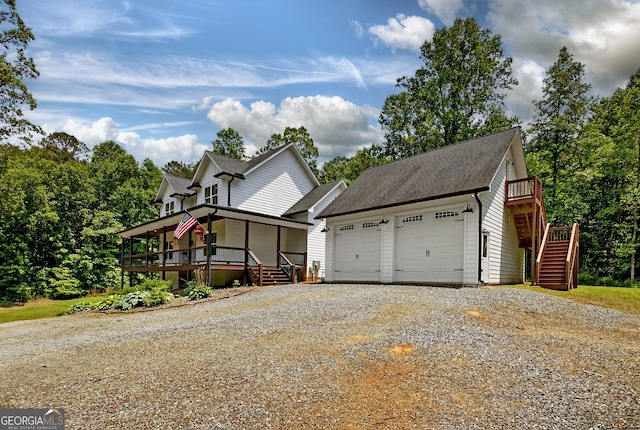57 Clear Creek Valley Dr Unit 8A, Ellijay, GA 30536 - view of front of house with driveway, stairs, covered porch, roof with shingles, and an attached garage