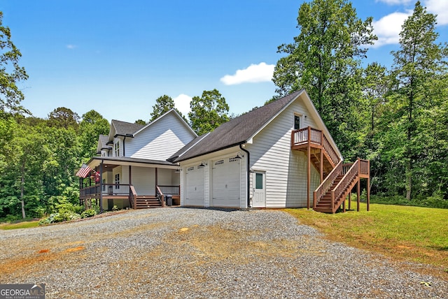 57 Clear Creek Valley Dr Unit 8A, Ellijay, GA 30536 - view of front facade with stairs, a porch, roof with shingles, driveway, and a front yard