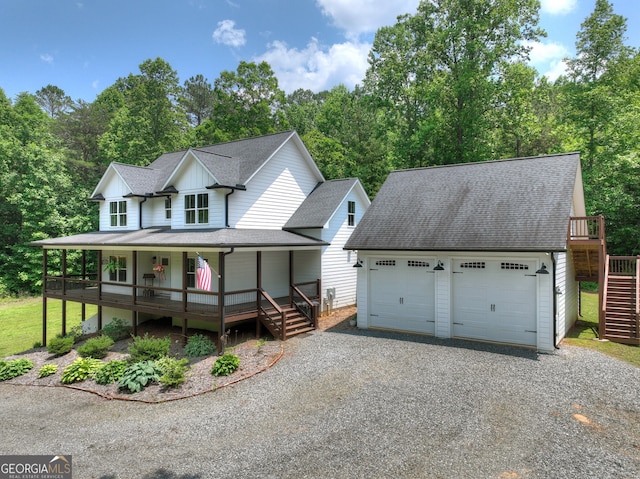57 Clear Creek Valley Dr Unit 8A, Ellijay, GA 30536 - view of front of home featuring a porch, stairway, roof with shingles, and an outbuilding