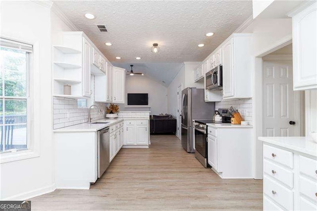 3185 Perch Dr SW, Marietta, GA 30008 - kitchen with stainless steel appliances, a sink, a ceiling fan, open shelves, and a textured ceiling