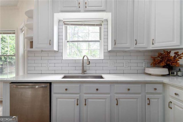 3185 Perch Dr SW, Marietta, GA 30008 - kitchen with dishwasher, a sink, white cabinetry, tasteful backsplash, and light countertops
