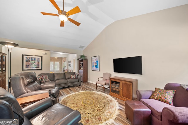 3633 Gilpin Ct, Lawren, GA 30044 - living area with vaulted ceiling, a ceiling fan, wood finished floors, and baseboards