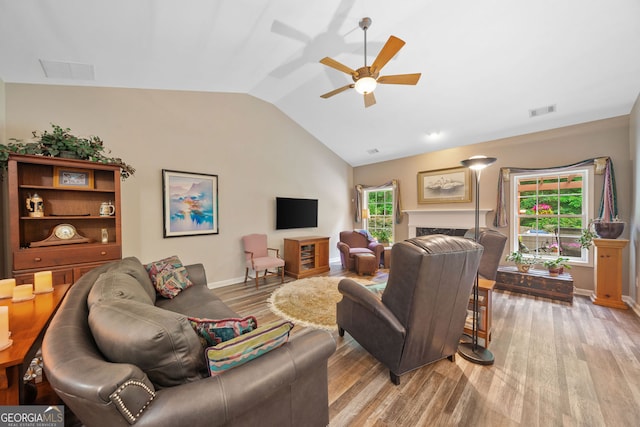 3633 Gilpin Ct, Lawren, GA 30044 - living area with vaulted ceiling, light wood-type flooring, ceiling fan, and baseboards