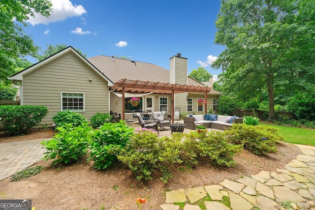 3633 Gilpin Ct, Lawren, GA 30044 - back of property featuring an outdoor hangout area, a pergola, a patio, and a chimney
