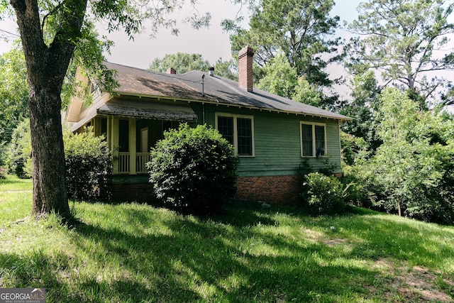 8 D Ave, Thomaston, GA 30286 - view of property exterior with a yard and a chimney