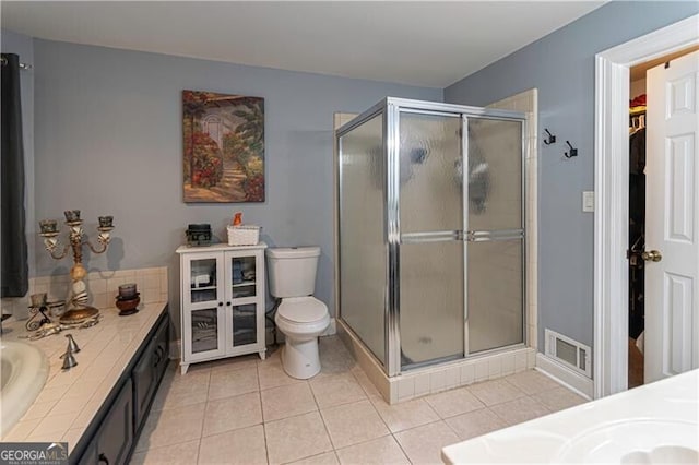 2050 Lyda Ln, Loganville, GA 30052 - full bathroom featuring vanity, a stall shower, and toilet