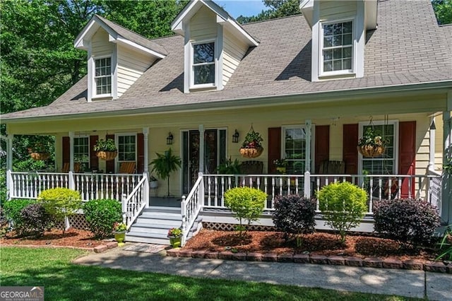 2050 Lyda Ln, Loganville, GA 30052 - cape cod house with a porch and a shingled roof