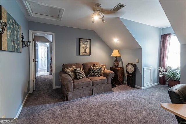 2050 Lyda Ln, Loganville, GA 30052 - carpeted living room featuring a ceiling fan, baseboards, lofted ceiling, and attic access