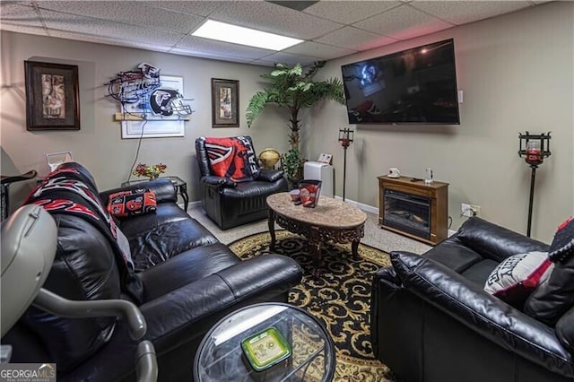 2050 Lyda Ln, Loganville, GA 30052 - living area with carpet floors, a drop ceiling, and baseboards